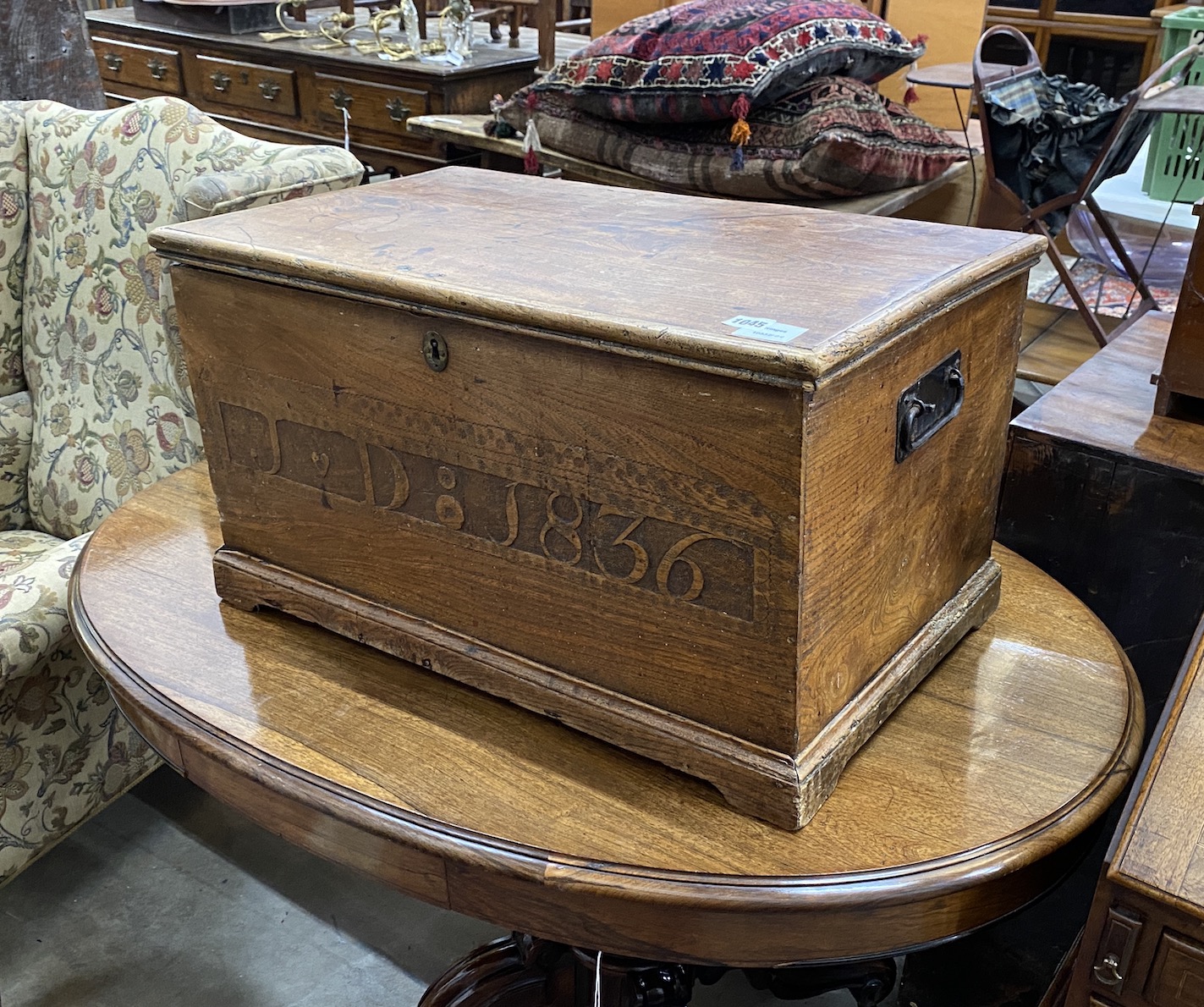 A small 19th century elm chest, the front with carved monogram JD and dated 1836, width 66cm, depth 40cm, height 38cm